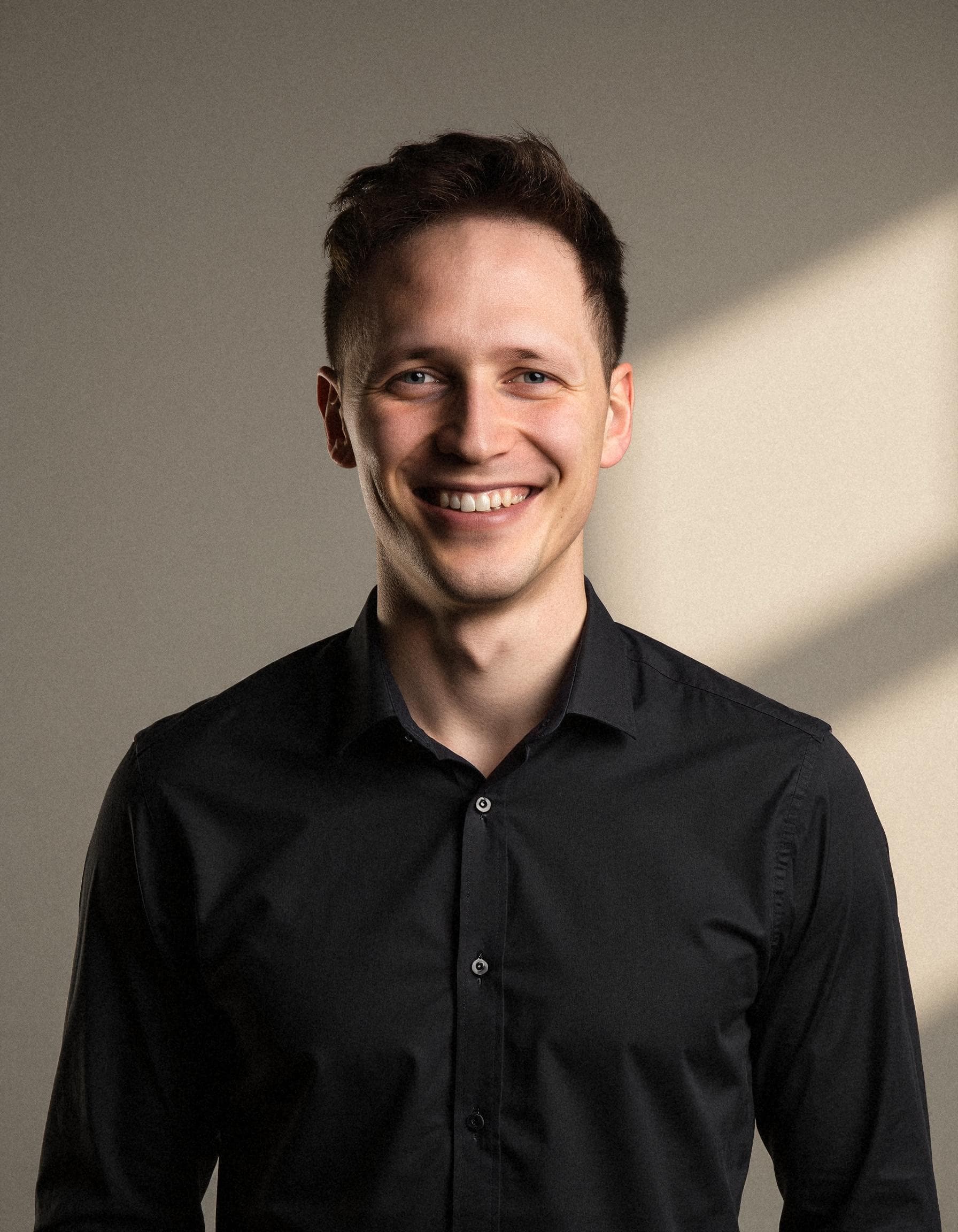 Side-by-side comparison of AI-generated professional headshots from SnapProHead and HeadshotPro